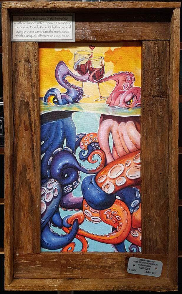 A framed mini canvas artwork featuring marine life with an abstract and colorful style, signed by Steve Diossy, with a frame made from authentic lobster trap wood from the Florida Keys