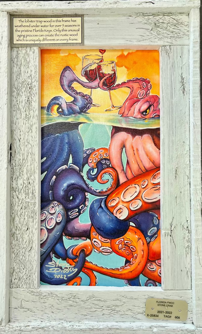 A framed mini canvas artwork featuring marine life with an abstract and colorful style, signed by Steve Diossy, with a white wash finished frame.
